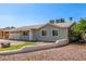 Well-maintained home with a two-car garage, complemented by desert landscaping at 7047 W Almeria Rd, Phoenix, AZ 85035