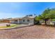 Well-maintained home with a two-car garage, complemented by desert landscaping at 7047 W Almeria Rd, Phoenix, AZ 85035