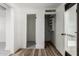Hallway with wood flooring showcasing closet and interior doors at 7047 W Almeria Rd, Phoenix, AZ 85035