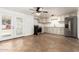 Bright kitchen features modern appliances and opens to a spacious living area with Saltillo tile flooring at 7047 W Almeria Rd, Phoenix, AZ 85035