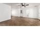 Spacious living room featuring Saltillo tile floors, neutral paint, and ample natural light at 7047 W Almeria Rd, Phoenix, AZ 85035