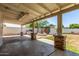 Wide shot of an outdoor patio with stone pillars, outdoor grill, and fountain at 7047 W Almeria Rd, Phoenix, AZ 85035