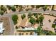 An aerial shot reveals the property's layout, featuring a pool, well-kept yard, and the surrounding neighborhood at 7102 E Kalil Dr, Scottsdale, AZ 85254