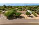 Aerial view of a charming property featuring a pool, guest house, and desert landscaping at 7102 E Kalil Dr, Scottsdale, AZ 85254