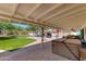 Backyard with a hot tub, outdoor furniture, and artificial grass at 7102 E Kalil Dr, Scottsdale, AZ 85254