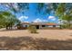 Charming single-story home featuring desert landscaping, a well-maintained exterior and a welcoming facade at 7102 E Kalil Dr, Scottsdale, AZ 85254