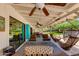 Outdoor patio with fans, furniture, and views of the desert landscape at 7102 E Kalil Dr, Scottsdale, AZ 85254
