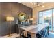 Dining room showcasing modern decor, wood table, and an adjacent covered outdoor seating area at 7330 E Vista Bonita Dr, Scottsdale, AZ 85255
