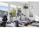Bright community gym with treadmills, elliptical, rowing machine, and view of the pool at 7330 E Vista Bonita Dr, Scottsdale, AZ 85255