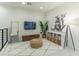 Bright living area with patterned rug, television, storage unit, and decorative accessories and plenty of natural light at 7330 E Vista Bonita Dr, Scottsdale, AZ 85255