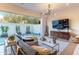 Inviting living room with modern lighting, sleek furniture, and sliding glass doors to the outdoor patio at 7330 E Vista Bonita Dr, Scottsdale, AZ 85255