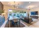 Open-concept living space with large sliding windows, dining area, and comfortable seating arrangement at 7330 E Vista Bonita Dr, Scottsdale, AZ 85255