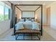 Main bedroom with four poster bed with soft white linens and neutral walls and views of the neighborhood at 7330 E Vista Bonita Dr, Scottsdale, AZ 85255