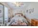 Stylishly decorated bedroom with a comfortable bed, decorative pillows, and coordinated accessories and wall decor at 7807 E Main St # H-27, Mesa, AZ 85207
