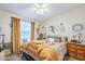 Inviting bedroom with soft lighting, ceiling fan, and stylish furnishings at 7807 E Main St # H-27, Mesa, AZ 85207