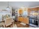 Functional kitchen adjacent to dining area, featuring essential appliances and ample cabinet space at 7807 E Main St # H-27, Mesa, AZ 85207