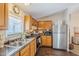 Efficient kitchen featuring stainless steel refrigerator and ample counter space at 7807 E Main St # H-27, Mesa, AZ 85207
