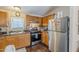 Functional kitchen with gas range, tile backsplash and stainless steel appliances at 7807 E Main St # H-27, Mesa, AZ 85207