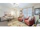Comfortable living room with plush seating, natural light, and stylish decor at 7807 E Main St # H-27, Mesa, AZ 85207