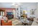 Cozy living room with fireplace, TV, comfortable seating, and elegant decor at 7807 E Main St # H-27, Mesa, AZ 85207