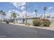 A well maintained street view of single story homes with covered parking and desert landscaping at 7807 E Main St # H-27, Mesa, AZ 85207