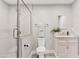 The bathroom features a glass shower, modern vanity, and neutral finishes at 818 W Earll Dr, Phoenix, AZ 85013