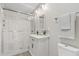 The bathroom features a glass shower, modern vanity, and neutral finishes at 818 W Earll Dr, Phoenix, AZ 85013