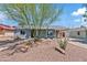 Charming single-story home featuring a desert landscaped yard and covered porch at 818 W Earll Dr, Phoenix, AZ 85013