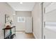 Hallway features a serving cart, bright window and modern accents at 818 W Earll Dr, Phoenix, AZ 85013