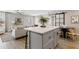 Modern kitchen with an island, stainless steel appliances, and open floor plan at 818 W Earll Dr, Phoenix, AZ 85013