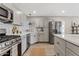 Modern kitchen with an island, stainless steel appliances, and plenty of counter space at 818 W Earll Dr, Phoenix, AZ 85013