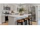 Modern kitchen with an island, stainless steel appliances, and plenty of counter space at 818 W Earll Dr, Phoenix, AZ 85013