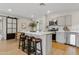 Modern kitchen with an island, stainless steel appliances, and a breakfast bar at 818 W Earll Dr, Phoenix, AZ 85013