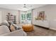 Bright living room with modern furnishings, hardwood floors, and large windows at 818 W Earll Dr, Phoenix, AZ 85013
