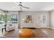Bright living room with modern furnishings, hardwood floors, and large windows at 818 W Earll Dr, Phoenix, AZ 85013