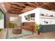 Rendered living room features a cozy seating area, fireplace and wet bar, blending modern design with comfort at 818 W Earll Dr, Phoenix, AZ 85013