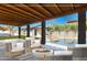Back patio rendering features a cozy seating area, in-ground fire pit, and view of the refreshing pool at 818 W Earll Dr, Phoenix, AZ 85013