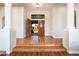 Grand foyer with hardwood floors and a view of the courtyard at 8977 E Ludlow Dr, Scottsdale, AZ 85260