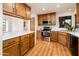 Traditional kitchen featuring wooden cabinets, stainless steel appliances, and ample counter space at 8977 E Ludlow Dr, Scottsdale, AZ 85260
