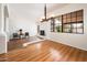 Bright living space with wood floors, large windows, and stylish lighting at 8977 E Ludlow Dr, Scottsdale, AZ 85260