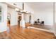 Spacious living room with wood floors, bright windows, and open layout design at 8977 E Ludlow Dr, Scottsdale, AZ 85260