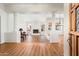 Bright living room features a fireplace, wood floors, and abundant natural light from large windows at 8977 E Ludlow Dr, Scottsdale, AZ 85260
