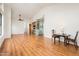 Open concept living room with wood floors, dining area, and kitchen view at 8977 E Ludlow Dr, Scottsdale, AZ 85260
