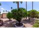 Landscaped gravel yard featuring mature trees and gravel ground cover at 9302 E Broadway Rd # 45, Mesa, AZ 85208