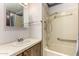 Bathroom featuring sink, shower with safety bars and detachable head, and medicine cabinet at 9302 E Broadway Rd # 45, Mesa, AZ 85208