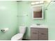 Bathroom area with light green walls, toilet, and vanity at 9302 E Broadway Rd # 45, Mesa, AZ 85208