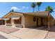 Single-story home featuring a covered carport for parking and desert landscaping at 9302 E Broadway Rd # 45, Mesa, AZ 85208