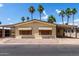 Well-maintained single-story home with a covered carport and desert landscaping at 9302 E Broadway Rd # 45, Mesa, AZ 85208