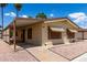 Well-maintained single-story home with a covered carport and desert landscaping at 9302 E Broadway Rd # 45, Mesa, AZ 85208