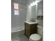 Bathroom with a combination shower and bathtub with white subway tile at 9603 N 1St Ave, Phoenix, AZ 85021